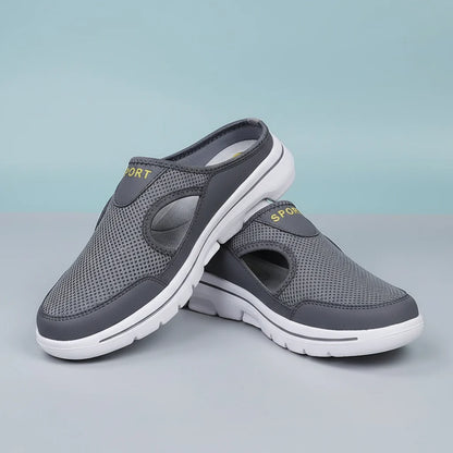 Men's orthopedic slip-on slippers featuring a breathable mesh upper, designed for wide fit comfort, perfect for both indoor and outdoor wear. 1