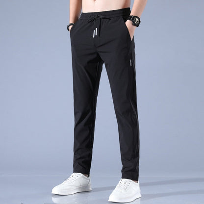 Men's quick-dry stretch trousers with drawstring, designed for comfort and flexibility in outdoor activities, featuring soft activewear fabric for optimal performance. 0