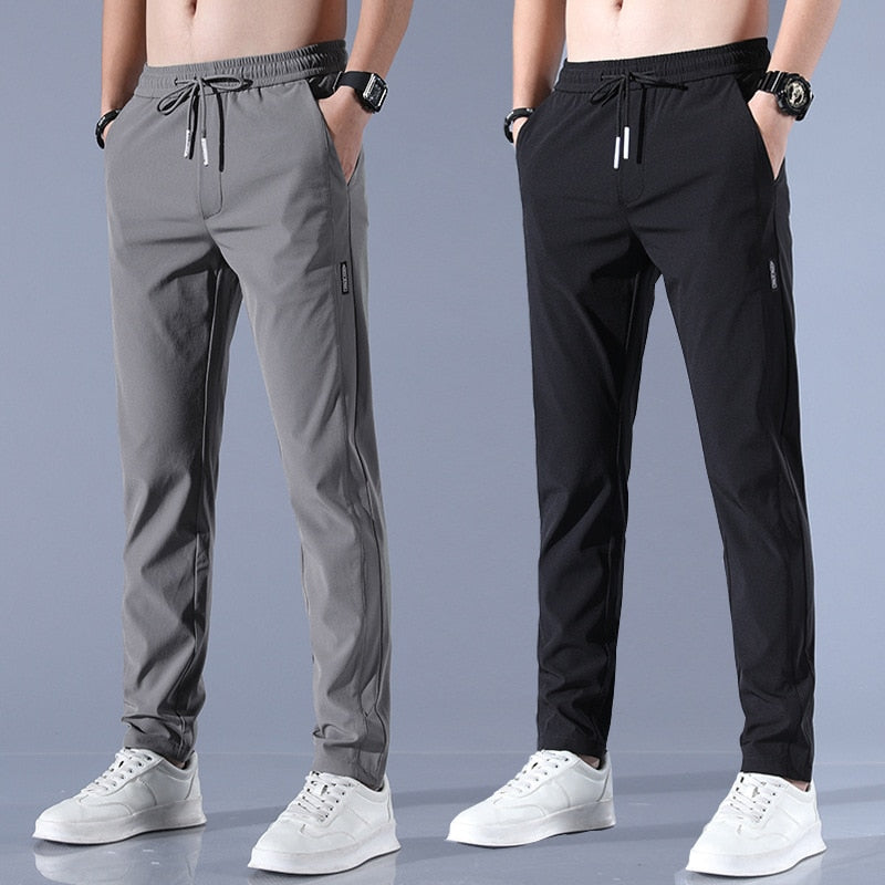 Men's quick-dry stretch trousers with drawstring, designed for comfort and flexibility in outdoor activities, featuring soft activewear fabric for optimal performance. 1