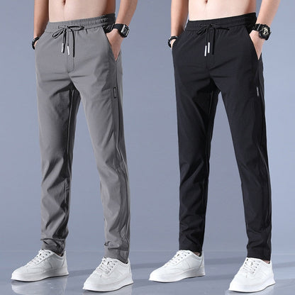 Men's quick-dry stretch trousers with drawstring, designed for comfort and flexibility in outdoor activities, featuring soft activewear fabric for optimal performance. 1