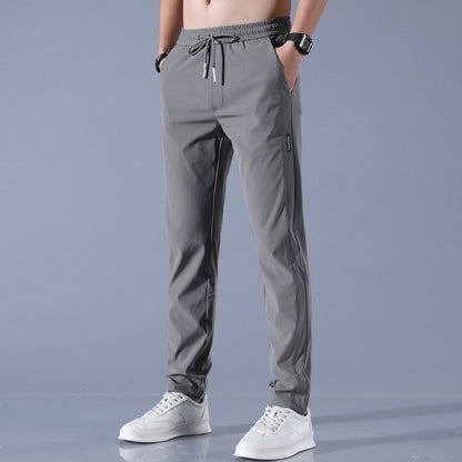 Men's quick-dry stretch trousers with drawstring, designed for comfort and flexibility in outdoor activities, featuring soft activewear fabric for optimal performance. 2