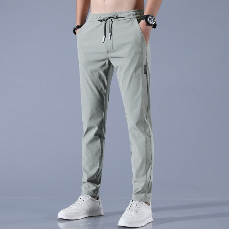Men's quick-dry stretch trousers with drawstring, designed for comfort and flexibility in outdoor activities, featuring soft activewear fabric for optimal performance. 3