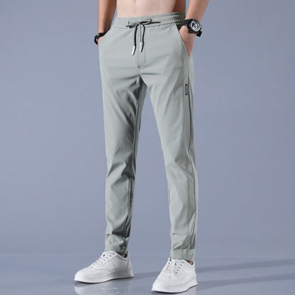 Men's quick-dry stretch trousers with drawstring, designed for comfort and flexibility in outdoor activities, featuring soft activewear fabric for optimal performance. 3
