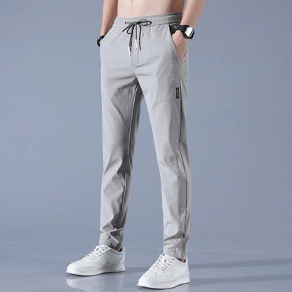 Men's quick-dry stretch trousers with drawstring, designed for comfort and flexibility in outdoor activities, featuring soft activewear fabric for optimal performance. 4