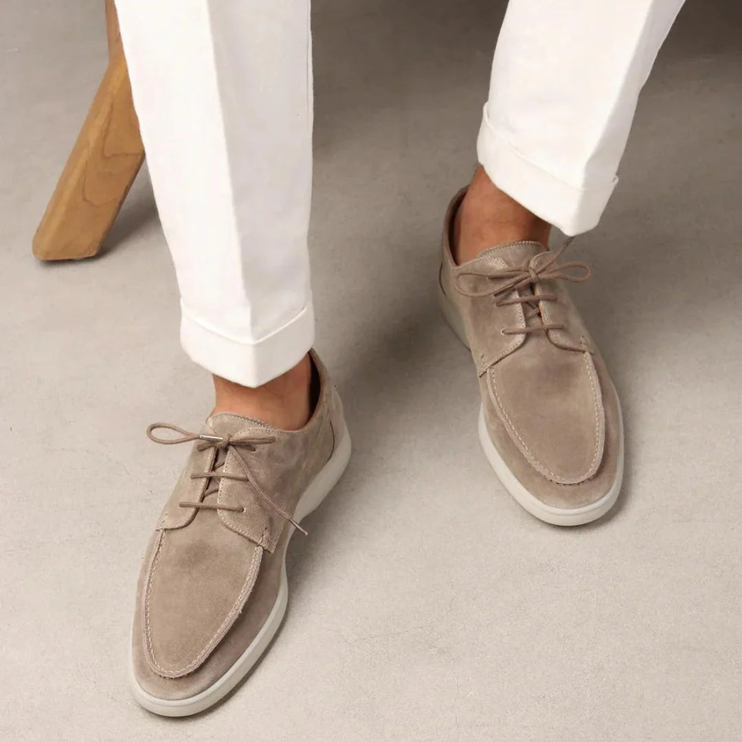 Men's sneakers featuring a cushioned rubber sole and soft suede upper, designed for comfort and style in casual lace-up design. 1