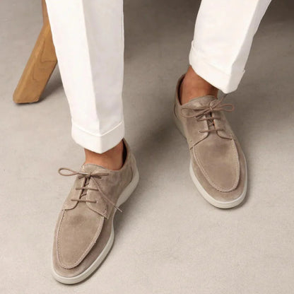 Men's sneakers featuring a cushioned rubber sole and soft suede upper, designed for comfort and style in casual lace-up design. 1