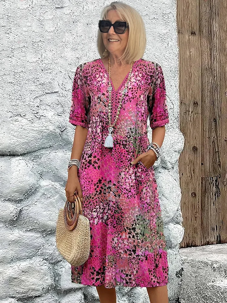 Midi dress featuring an abstract print and lace V-neck, designed for a soft, breathable casual style, complete with convenient side pockets. 0