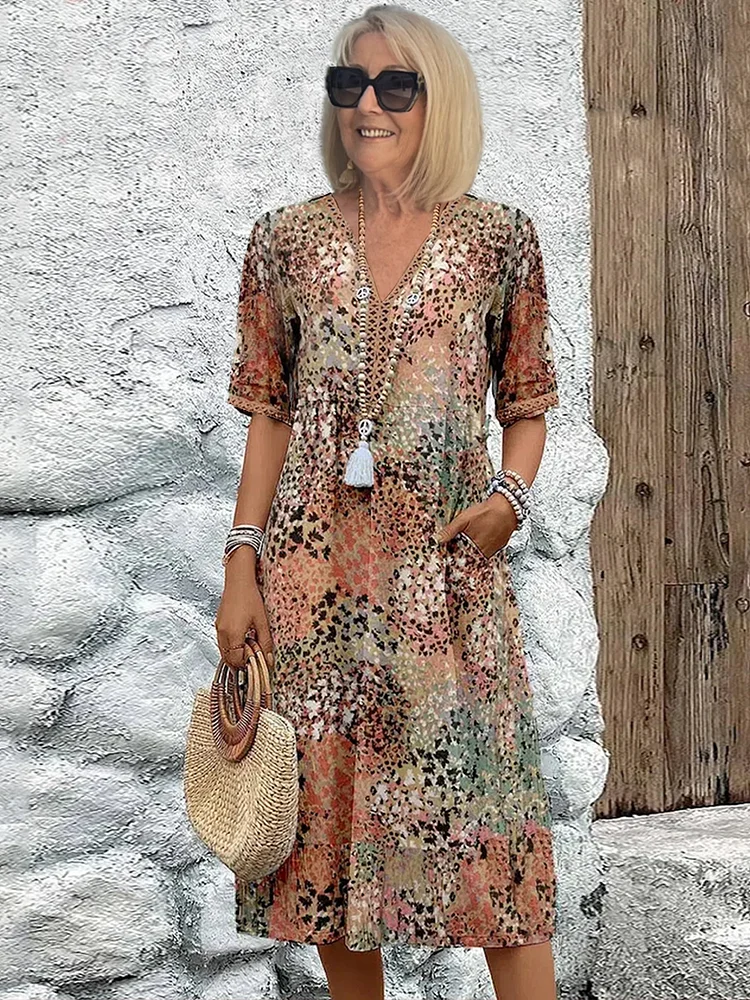Midi dress featuring an abstract print and lace V-neck, designed for a soft, breathable casual style, complete with convenient side pockets. 1