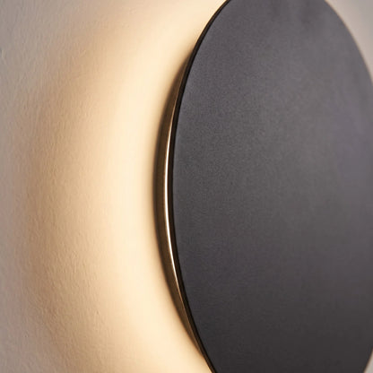 Minimalist LED wall light in black and white, featuring touch dimming and a wireless USB rechargeable design, perfect for modern home decor. 3