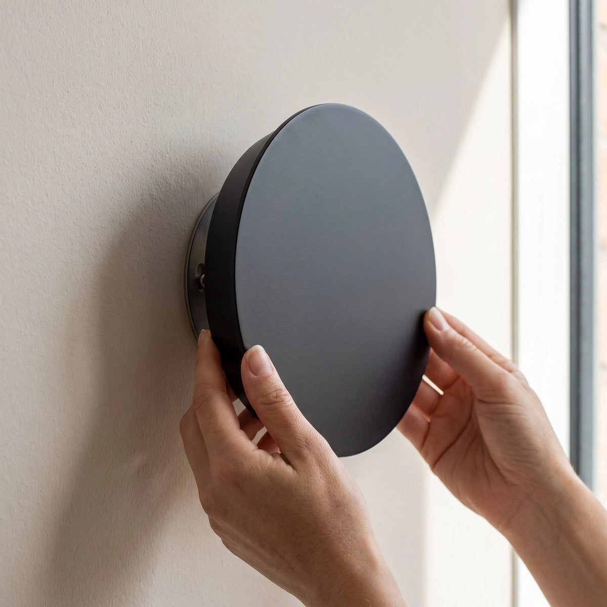 Minimalist LED wall light in black and white, featuring touch dimming and a wireless USB rechargeable design, perfect for modern home decor. 5