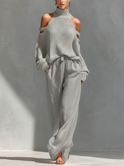 Off-shoulder two-piece set featuring a stylish top and wide-leg trousers, showcasing a modern feminine design perfect for summer outings and casual events. 1