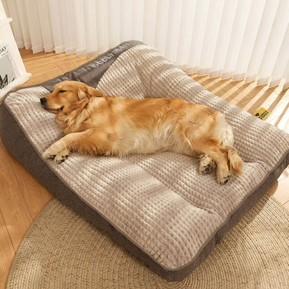 Orthopedic dog bed featuring a raised pillow and soft velor cover, designed for joint support and comfort for pets. 2