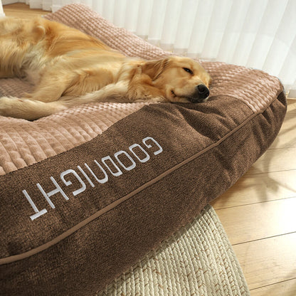 Orthopedic dog bed featuring a raised pillow and soft velor cover, designed for joint support and comfort for pets. 4