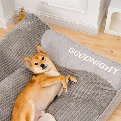 Orthopedic dog bed featuring a raised pillow and soft velor cover, designed for joint support and comfort for pets. 8