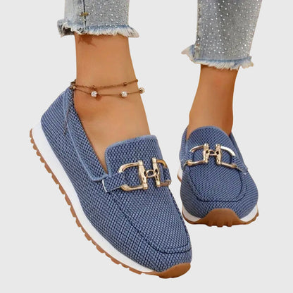 Orthopedic loafers featuring cushioned support and a breathable design, accented with elegant gold-tone details, perfect for comfort and style. 0