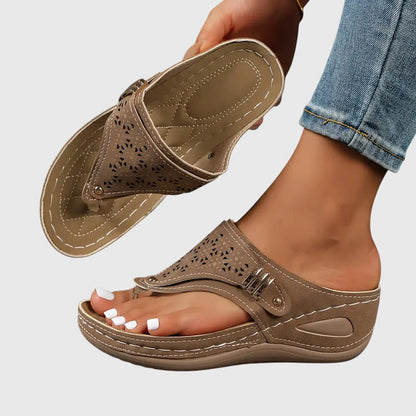 Orthopedic sandals for women featuring ergonomic support, a shock-absorbing sole, and a convenient slip-on design, ideal for all-day comfort and foot 1
