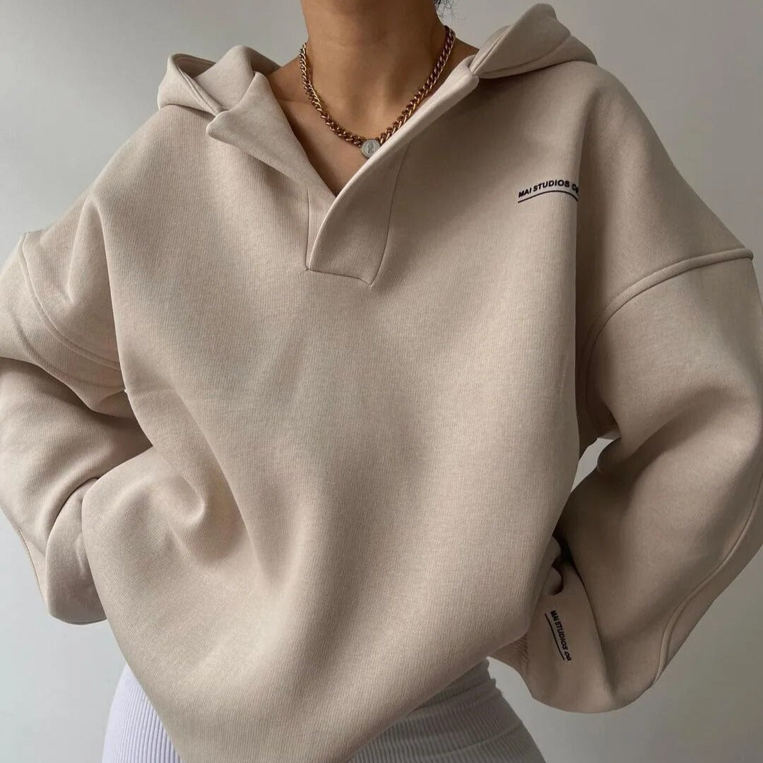 Oversized hoodie for women featuring a crossover hood, made from a soft cotton-polyester blend, perfect for casual lounge wear. 2