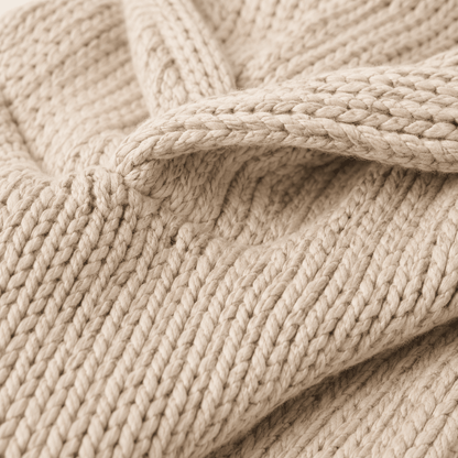 Oversized beige knit lounge hoodie with relaxed hood and chunky texture, perfect for cozy comfort and lounging at home. 2