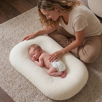 Pastel Baby Lounger Nest featuring breathable materials and raised edges for enhanced comfort and safety. 0