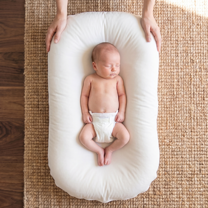 Pastel Baby Lounger Nest featuring breathable materials and raised edges for enhanced comfort and safety. 10