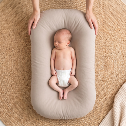 Pastel Baby Lounger Nest featuring breathable materials and raised edges for enhanced comfort and safety. 12