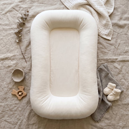Pastel Baby Lounger Nest featuring breathable materials and raised edges for enhanced comfort and safety. 8