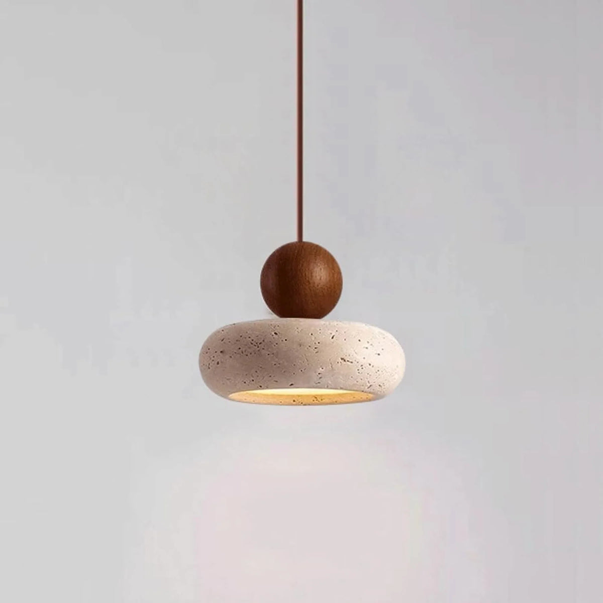 Pendant light featuring a warm LED glow, designed with a modern wood and concrete finish, perfect for compact kitchen and dining spaces. 2