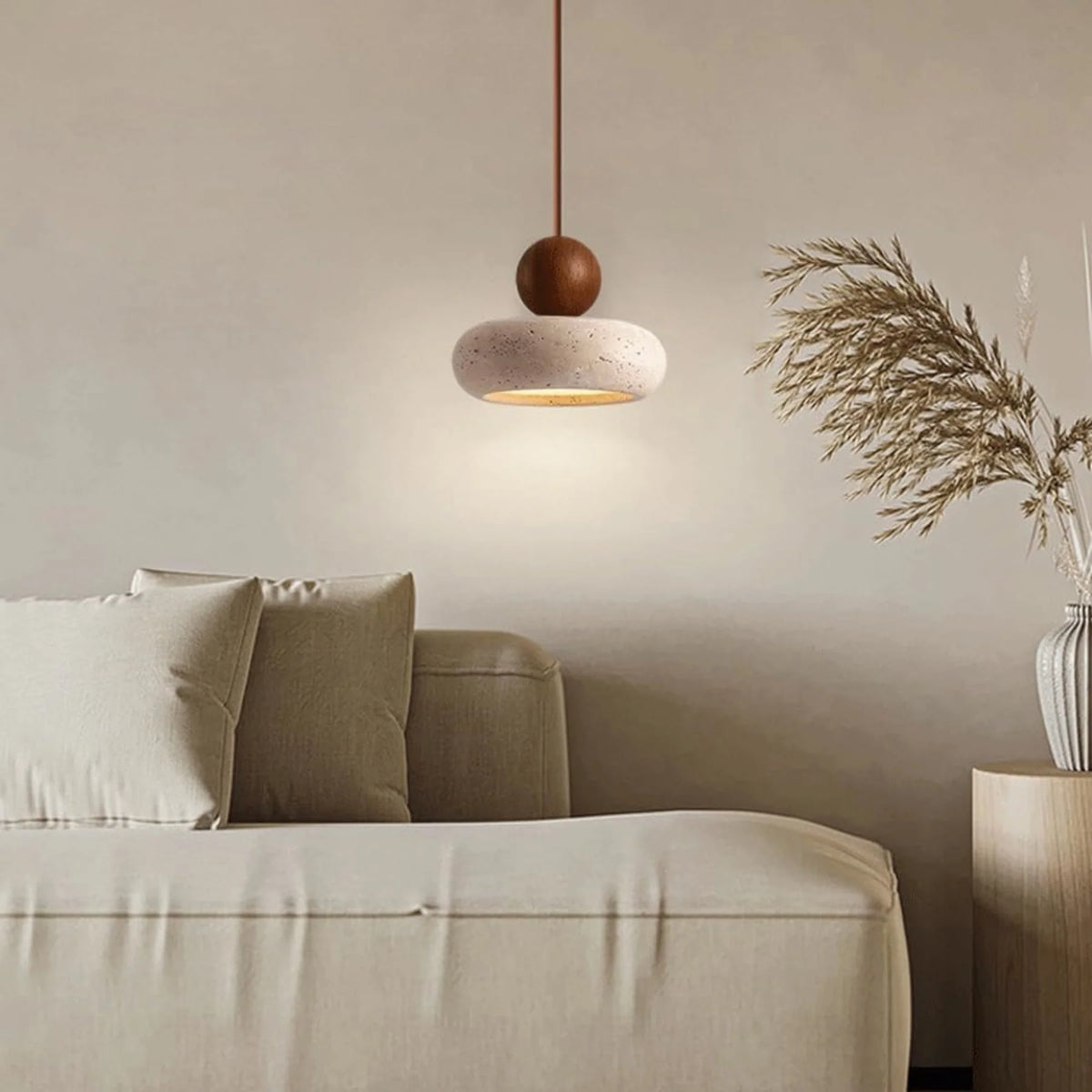Pendant light featuring a warm LED glow, designed with a modern wood and concrete finish, perfect for compact kitchen and dining spaces. 3