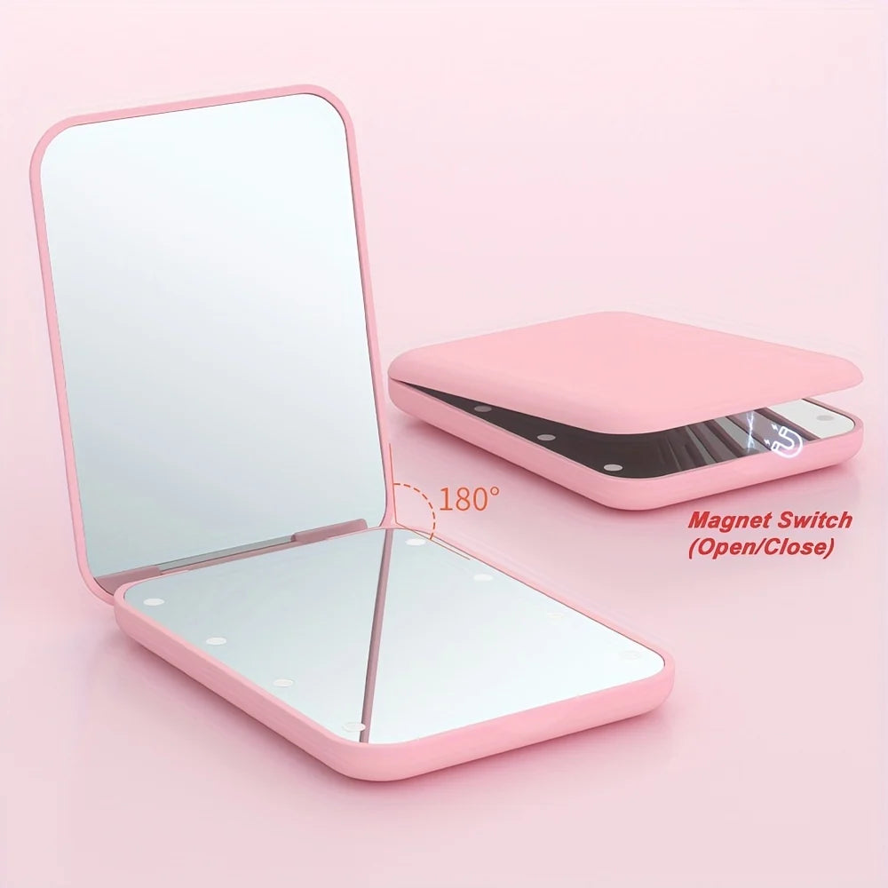 Pocket makeup mirror with LED light and dual magnification, featuring a compact design in stylish pink and green colors, perfect for on-the-go touch-ups and 2