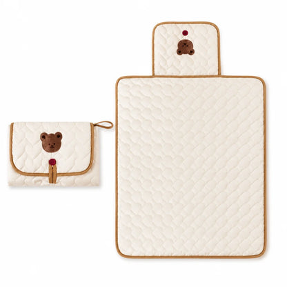 Portable baby diaper changing pad featuring a waterproof surface and convenient storage pockets, designed with an adorable bear theme for on-the-go parents. 1
