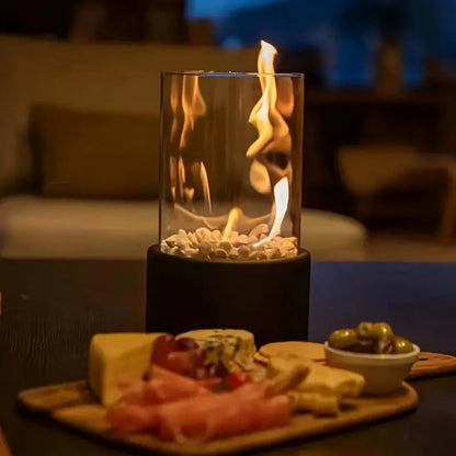 Portable tabletop fireplace featuring a sleek design with a bioethanol burner and glass panels, perfect for modern indoor settings. 6