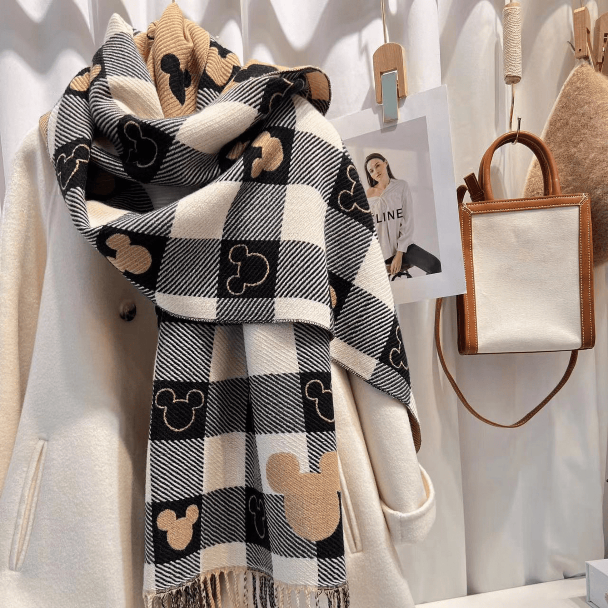 Reversible plaid scarf with tassels, featuring a lightweight and cozy design, made from a soft fabric blend, perfect for winter styling. 2