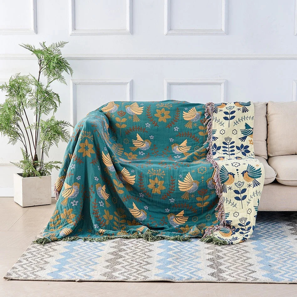 Reversible Scandinavian bird print throw blanket in multicolor, perfect for outdoor use, showcasing a vibrant design with birds and nature motifs. 0