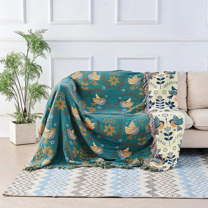 Reversible Scandinavian bird print throw blanket in multicolor, perfect for outdoor use, showcasing a vibrant design with birds and nature motifs. 0