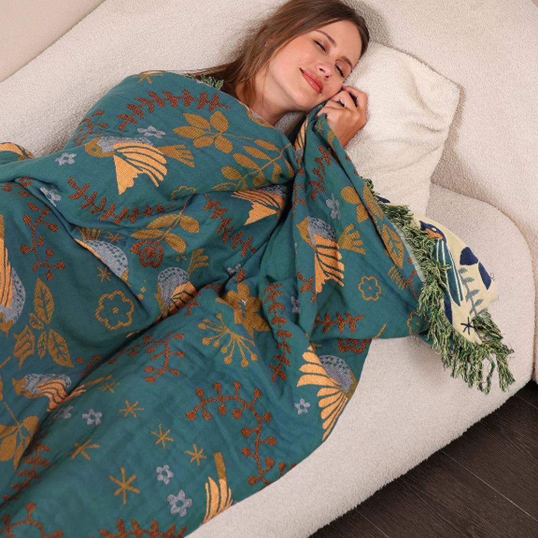 Reversible Scandinavian bird print throw blanket in multicolor, perfect for outdoor use, showcasing a vibrant design with birds and nature motifs. 4