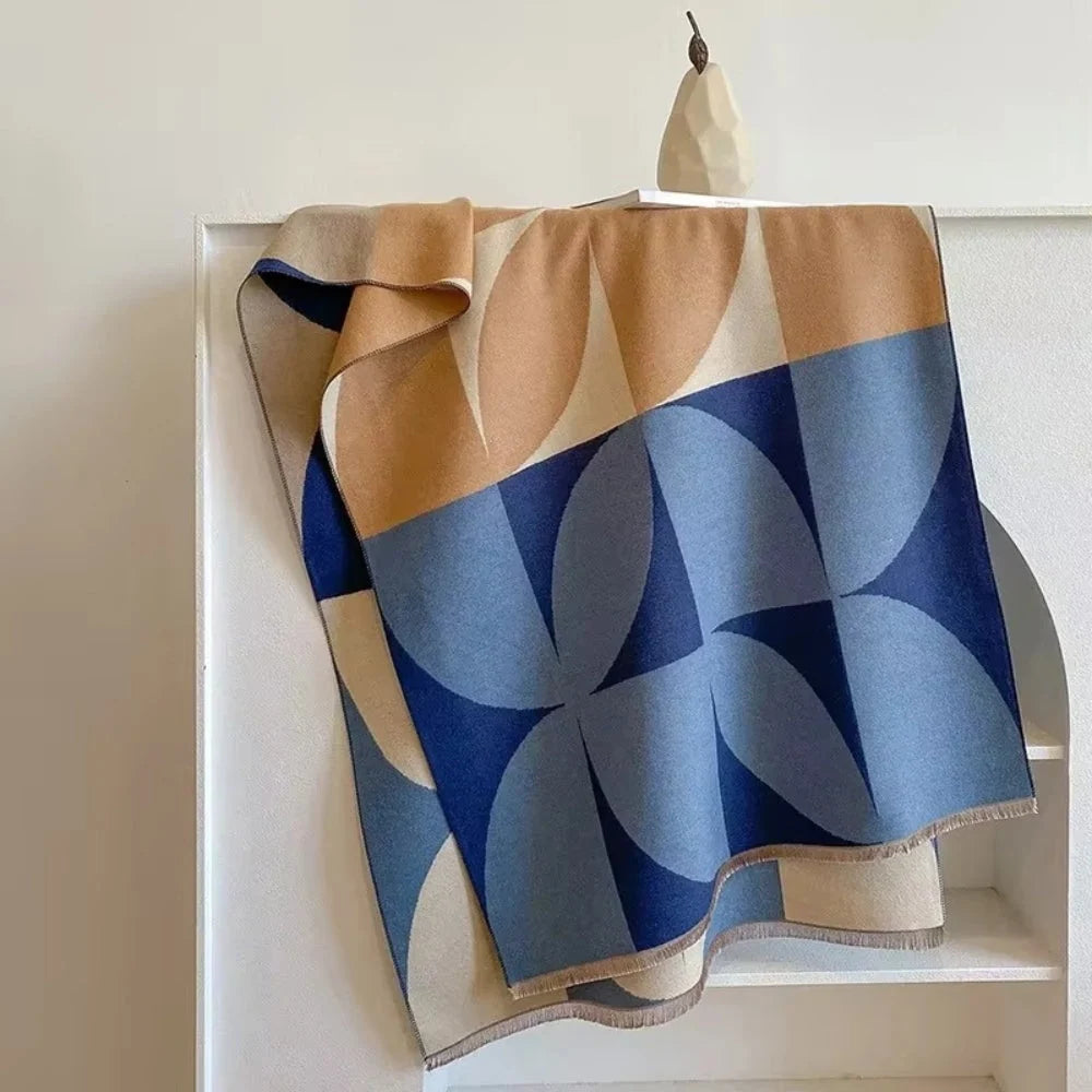 Reversible wrap scarf made from soft microfiber blend, featuring a lightweight design perfect for fall and winter styling. 1
