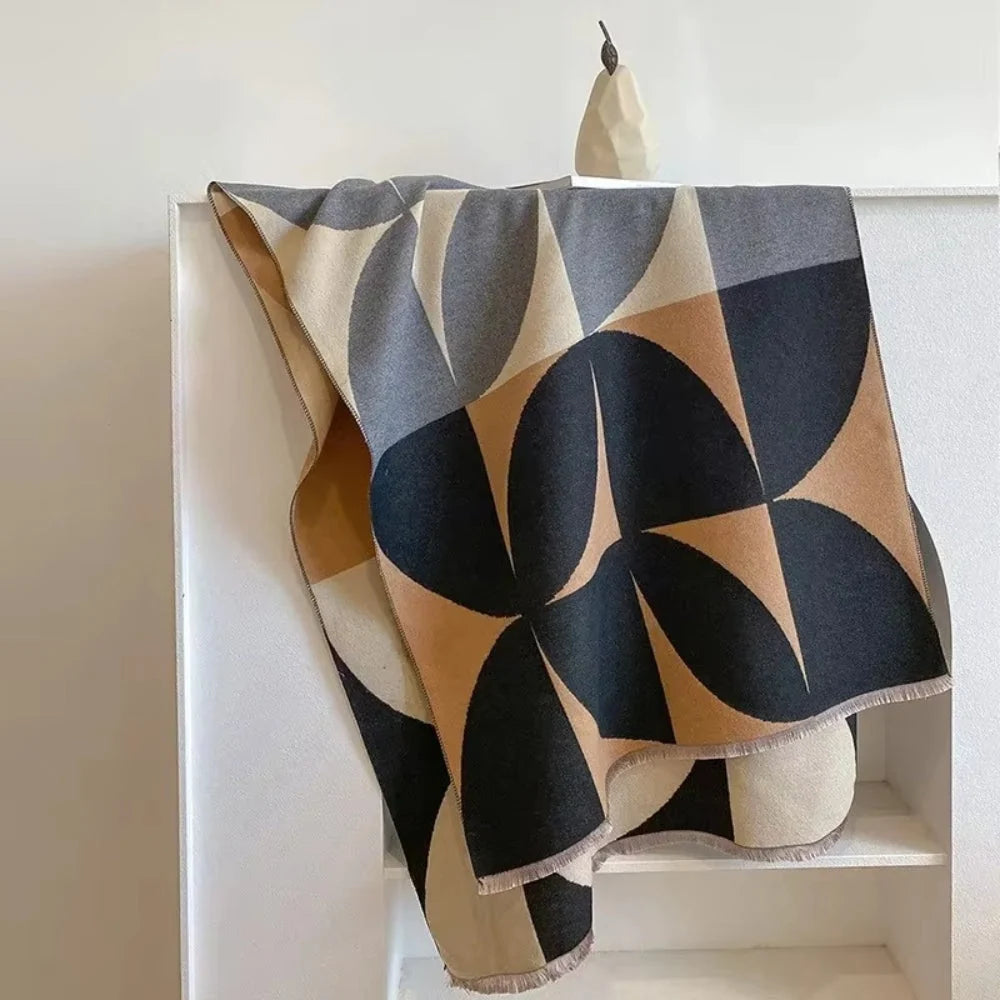 Reversible wrap scarf made from soft microfiber blend, featuring a lightweight design perfect for fall and winter styling. 2