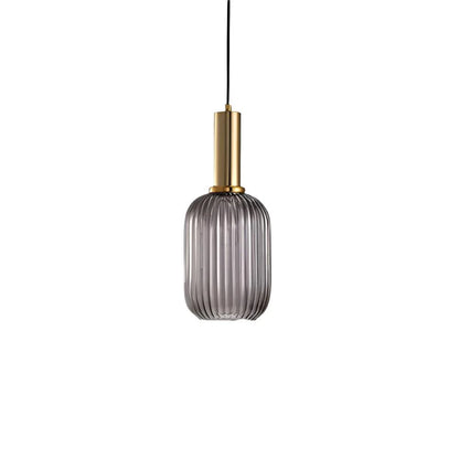 Ribbed glass pendant lights featuring a modern metal tube fitting, providing a warm ambient glow ideal for kitchen and dining spaces. 0