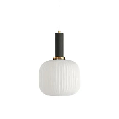 Ribbed glass pendant lights featuring a modern metal tube fitting, providing a warm ambient glow ideal for kitchen and dining spaces. 10