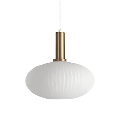 Ribbed glass pendant lights featuring a modern metal tube fitting, providing a warm ambient glow ideal for kitchen and dining spaces. 11