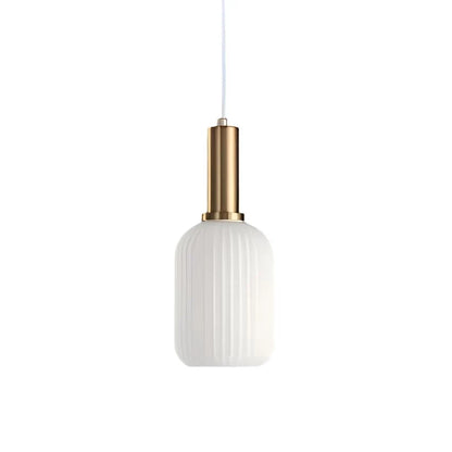 Ribbed glass pendant lights featuring a modern metal tube fitting, providing a warm ambient glow ideal for kitchen and dining spaces. 16