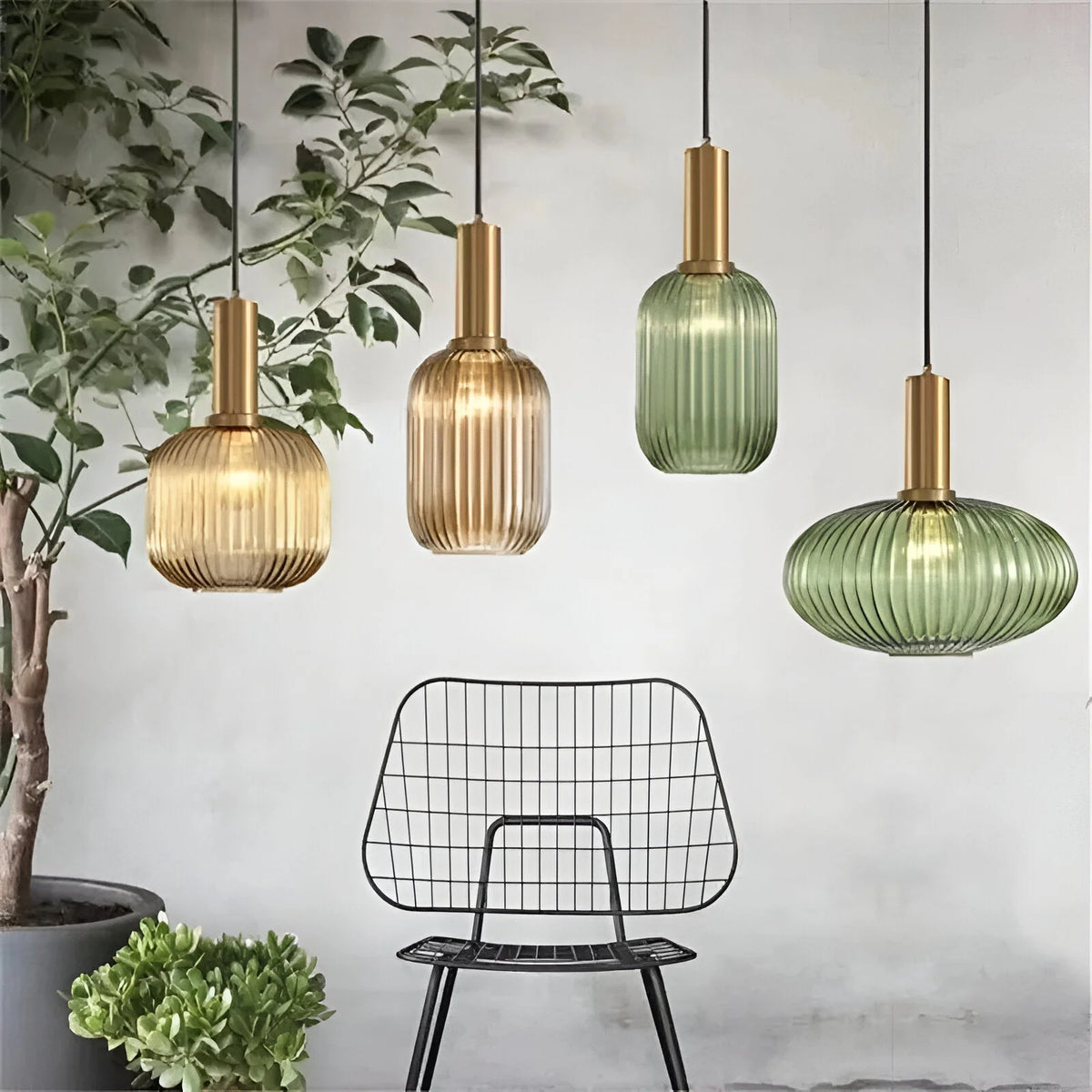 Ribbed glass pendant lights featuring a modern metal tube fitting, providing a warm ambient glow ideal for kitchen and dining spaces. 2