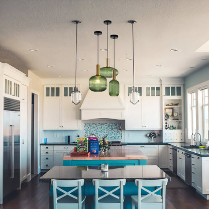 Ribbed glass pendant lights featuring a modern metal tube fitting, providing a warm ambient glow ideal for kitchen and dining spaces. 4