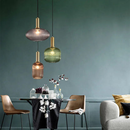 Ribbed glass pendant lights featuring a modern metal tube fitting, providing a warm ambient glow ideal for kitchen and dining spaces. 8