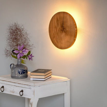 Round Oak Wall Light featuring Soft Indirect Lighting in a Minimalist Scandinavian Design, available in 22cm and 28cm diameter options. 4