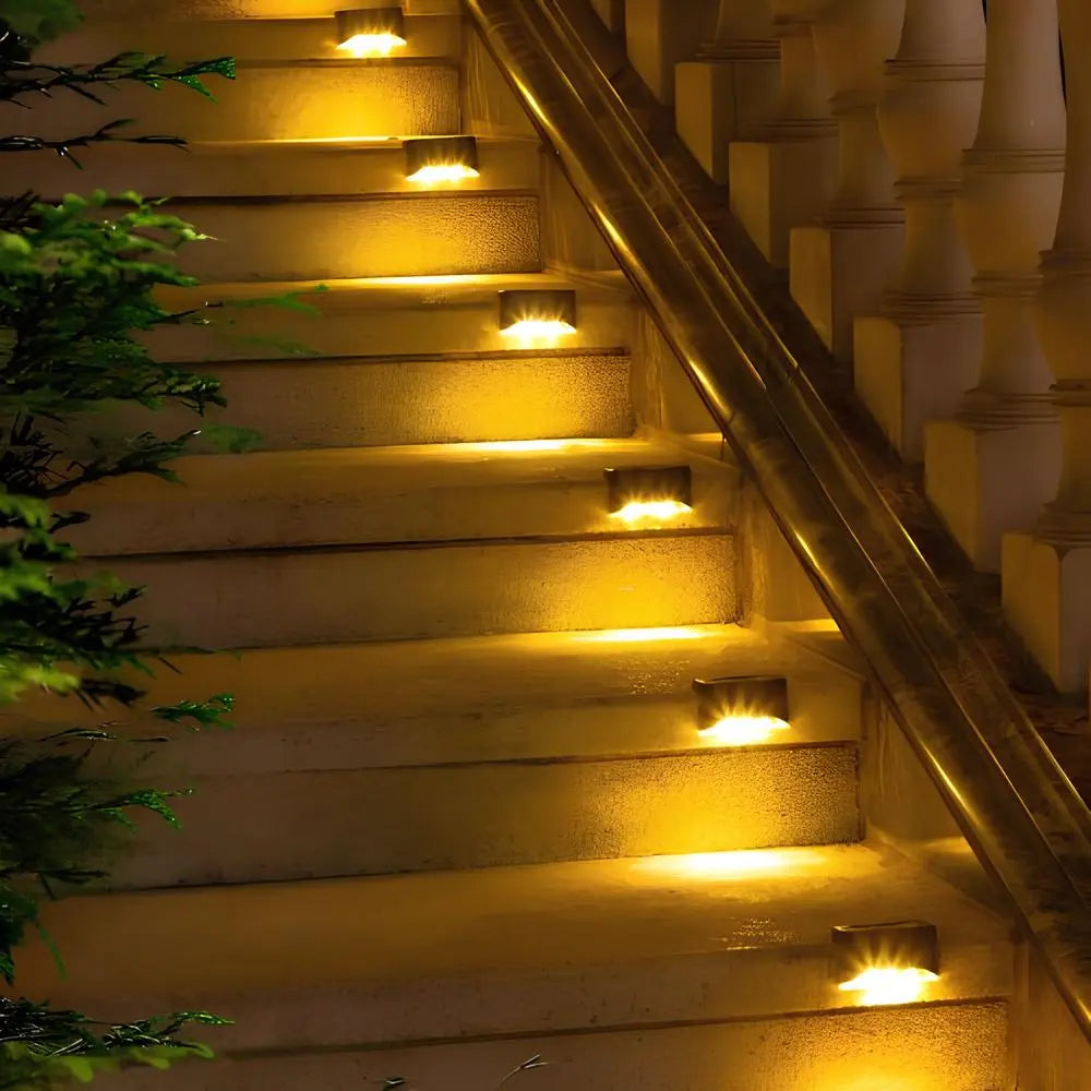 Solar step lights for outdoor use, featuring a compact design in brown or black housing, sold in an 8 pack, ideal for illuminating pathways and enhancing 3