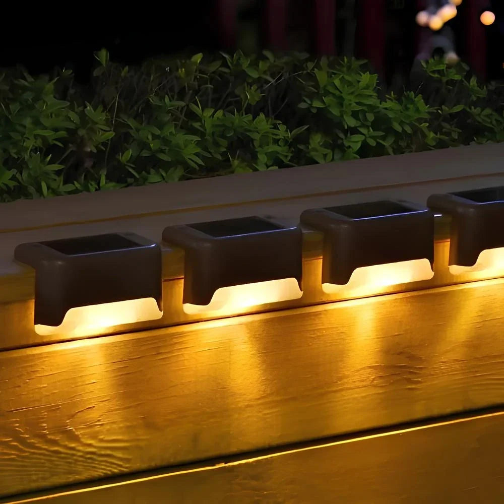 Solar step lights for outdoor use, featuring a compact design in brown or black housing, sold in an 8 pack, ideal for illuminating pathways and enhancing 8