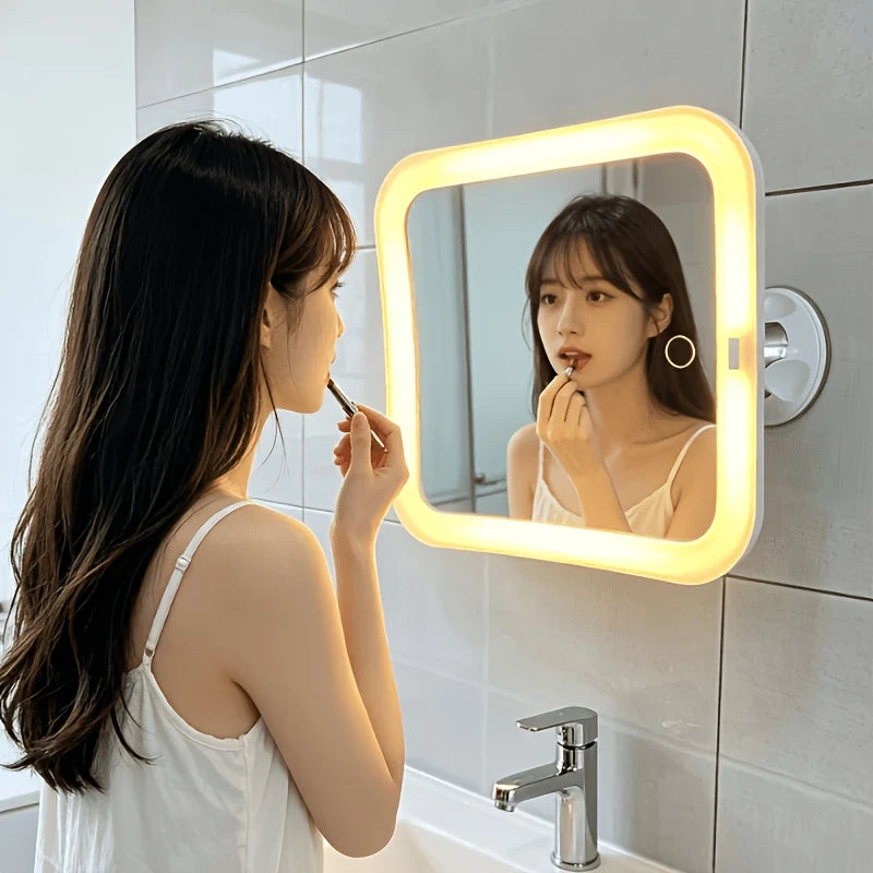 Suction cup makeup mirror featuring 10X magnification and dual LED lights, designed in white plastic and glass for a stylish vanity addition. 3