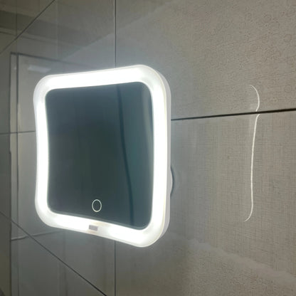 Suction cup makeup mirror featuring 10X magnification and dual LED lights, designed in white plastic and glass for a stylish vanity addition. 5