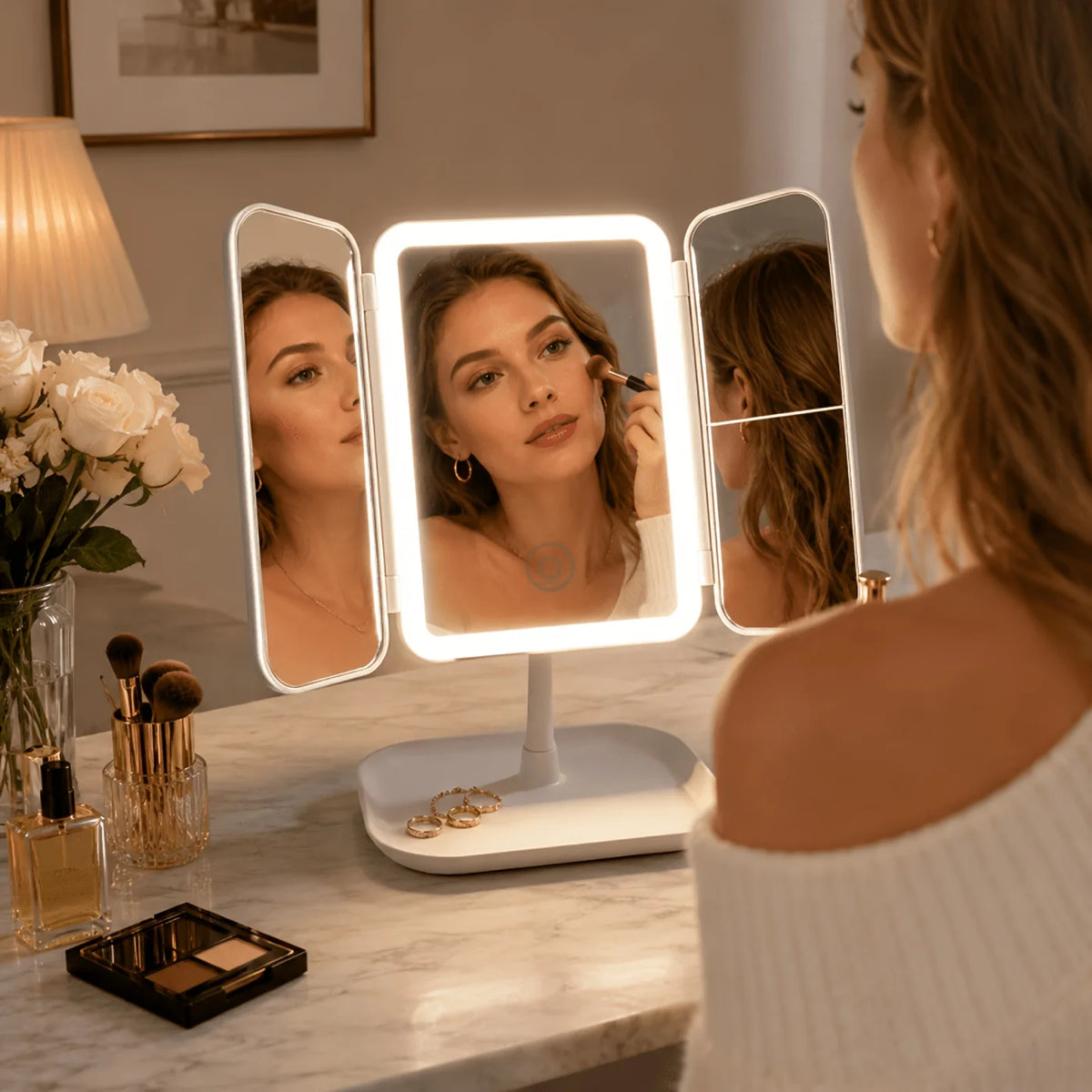 Tri-fold makeup mirror in white and pink featuring a touch light and 1X, 2X, 3X magnification for enhanced makeup application 2